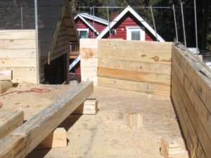 Wooden house foundation construction site.