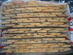 Stacked lumber ready for construction or carpentry.