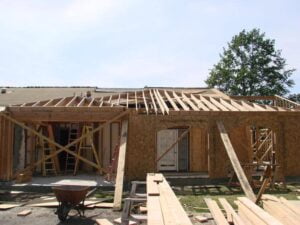 House under construction with wooden frame.