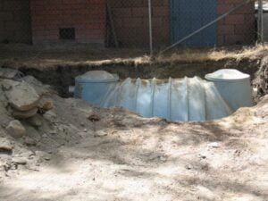 Collapsed corrugated metal culvert in a trench.