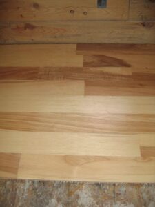 Wooden floor installation in progress.