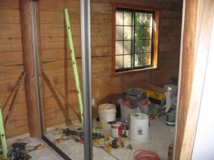 Interior construction site with tools and materials.