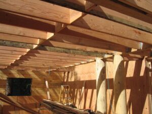 Wooden house framework under construction.