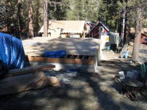 Construction site with foundation and building materials.