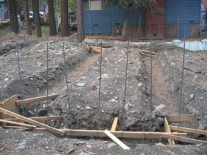 Foundation excavation site with formwork and rebars.